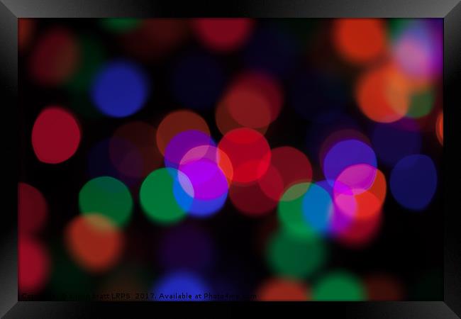 Large coloured party lights at night Framed Print by Simon Bratt LRPS