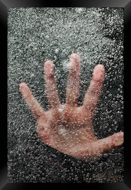 Mans hand below frozen lake drowning Framed Print by Simon Bratt LRPS