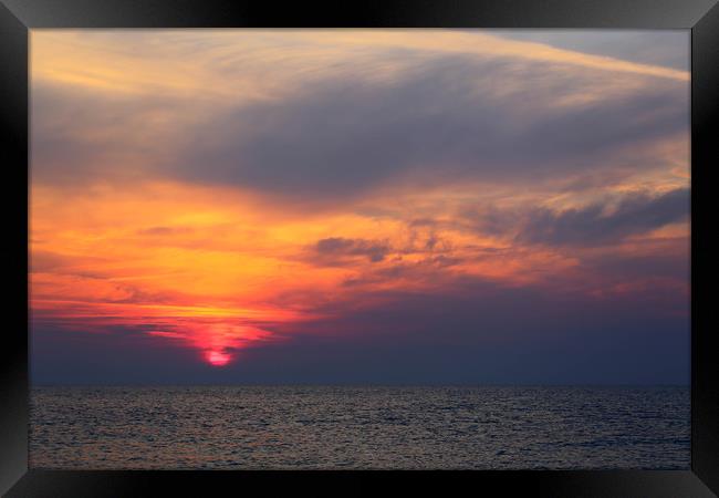 sunrise over the sea Framed Print by kevin murch