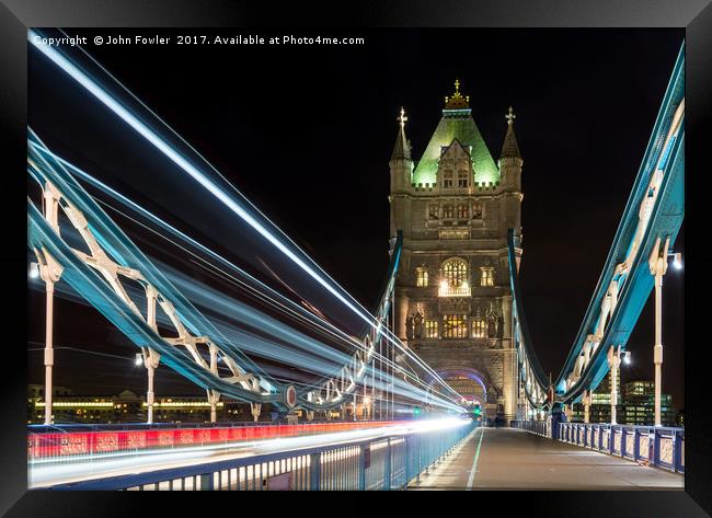 Tower Bridge Light Trails Framed Print by John Fowler