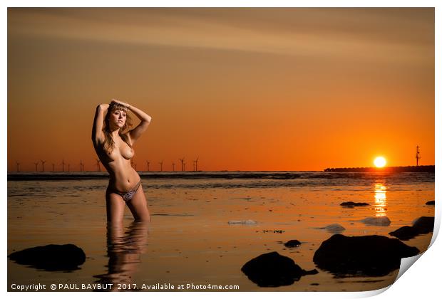 Topless young woman at sunset standing in the sea Print by PAUL BAYBUT