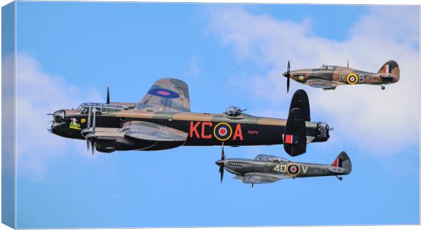 Lancaster Bomber PA474 flanked by BBMF's Hurricane Canvas Print by Andrew Scott