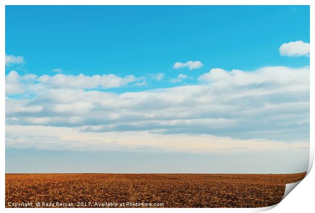 Cloudy Sky Over Harvested Land In Autumn Print by Radu Bercan