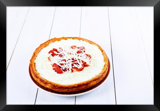 Homemade Strawberry Cheesecake On White Table Framed Print by Radu Bercan