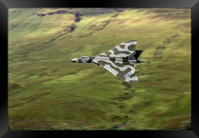 Vulcan B2 low-level against hillside Framed Print by Gary Eason