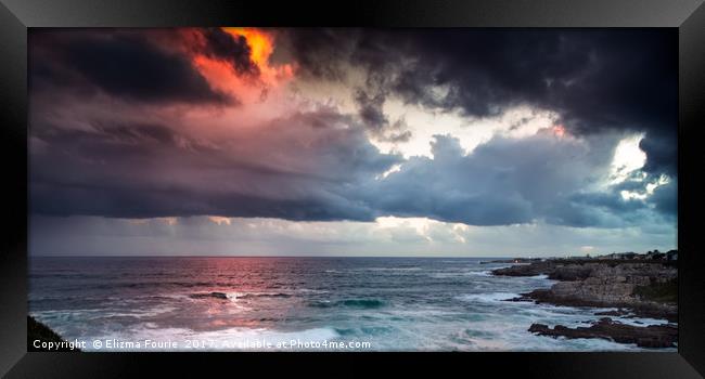 Heavy clouds at sunset Framed Print by Elizma Fourie