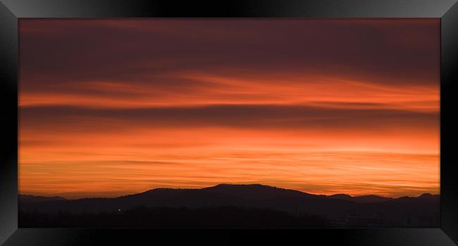 Sunset over Ljubljana suburb Framed Print by Ian Middleton