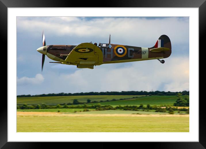 Low flying Spitfire over Duxford Framed Mounted Print by Oxon Images