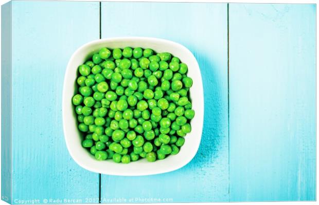 Fresh Green Peas In White Bowl On Turquoise Table Canvas Print by Radu Bercan