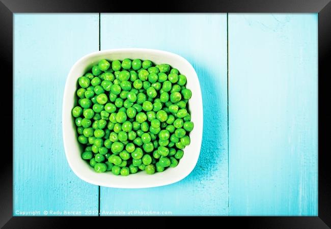 Fresh Green Peas In White Bowl On Turquoise Table Framed Print by Radu Bercan