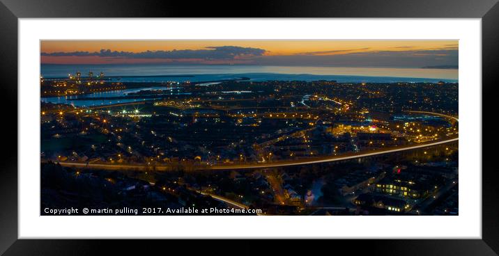 the sun goes down over Port Talbot Framed Mounted Print by martin pulling
