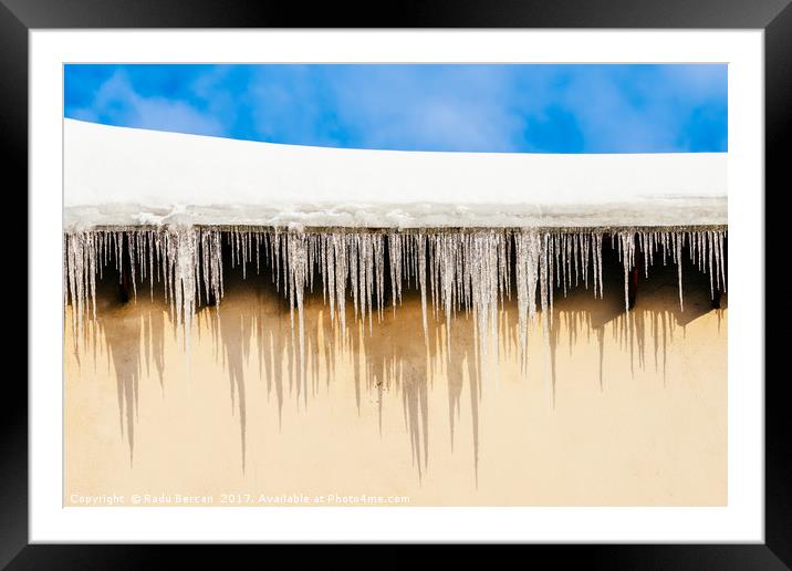 House Roof Covered In Snow And Dangerous Icicles Framed Mounted Print by Radu Bercan