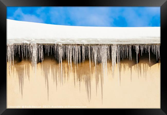 House Roof Covered In Snow And Dangerous Icicles Framed Print by Radu Bercan