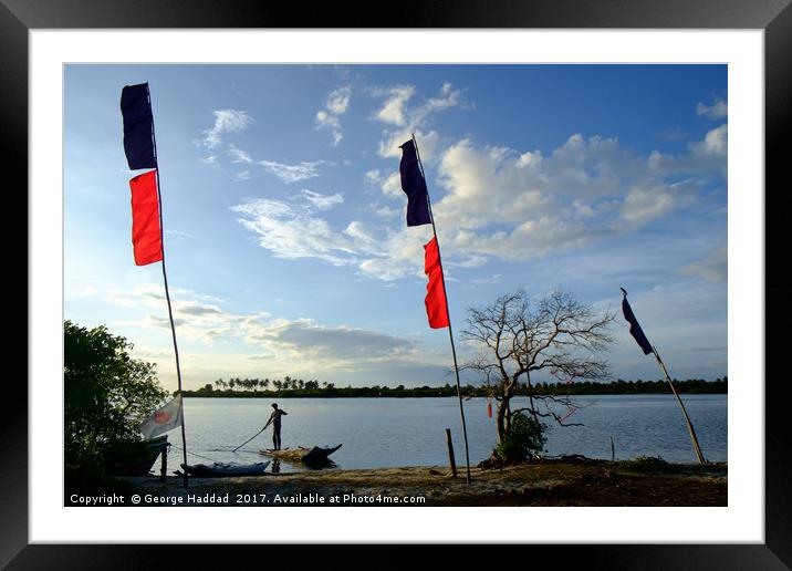 The stand up canoe Framed Mounted Print by George Haddad