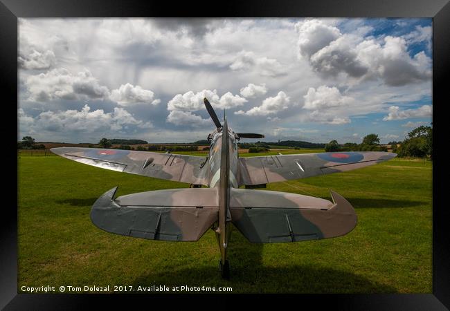 Spitfire under a Kentish sky Framed Print by Tom Dolezal