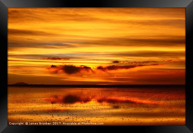 Sunset Reflected on the Salar de Uyuni Bolivia Framed Print by James Brunker