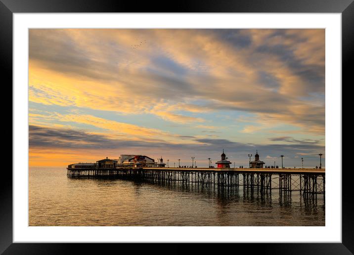 Blackpool north pier at sunset in winter  Framed Mounted Print by chris smith