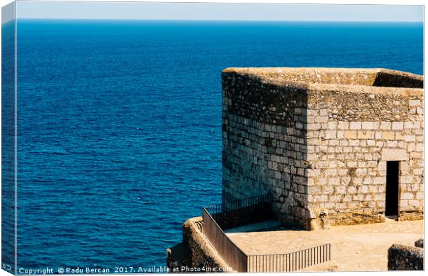 Old Castle Stone Wall And Tower With Ocean Backgro Canvas Print by Radu Bercan