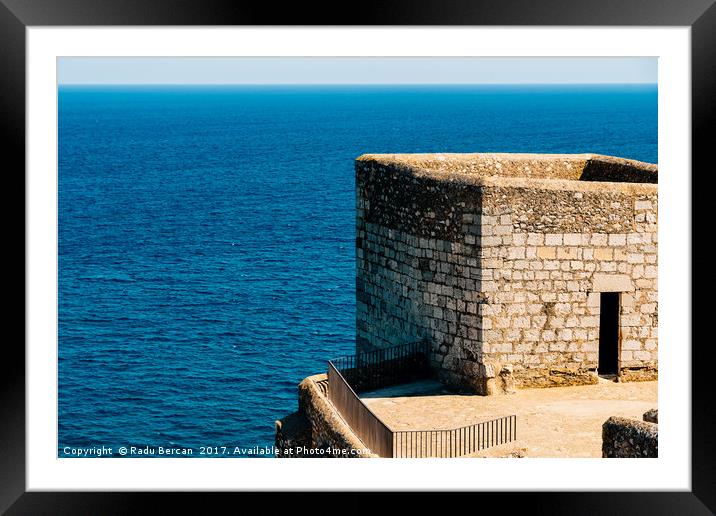 Old Castle Stone Wall And Tower With Ocean Backgro Framed Mounted Print by Radu Bercan