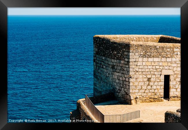 Old Castle Stone Wall And Tower With Ocean Backgro Framed Print by Radu Bercan