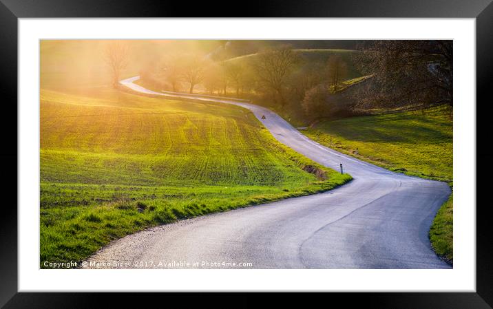 Road in a tuscan landscape at sunset  Framed Mounted Print by Marco Bicci