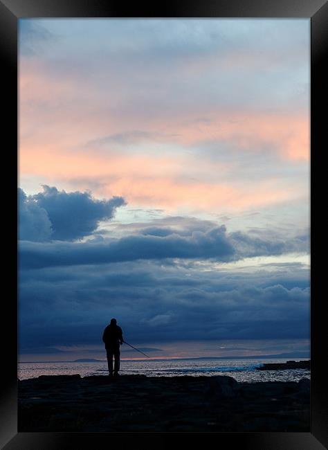 Sunset Fisherman Silouette Framed Print by Martin Doheny