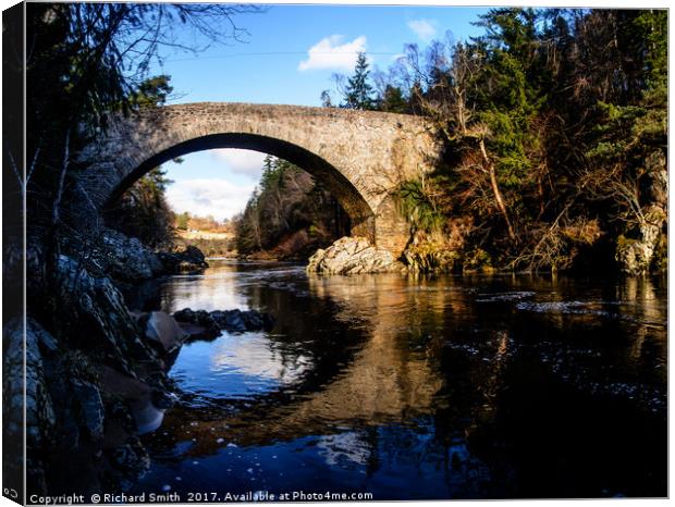A bridge over the Findhorn river Canvas Print by Richard Smith