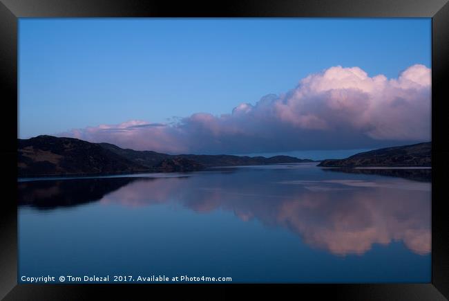 Clouds over the loch. Framed Print by Tom Dolezal