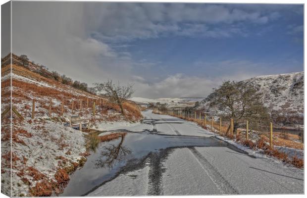 Road through the snow, Elan Valley Canvas Print by Sorcha Lewis