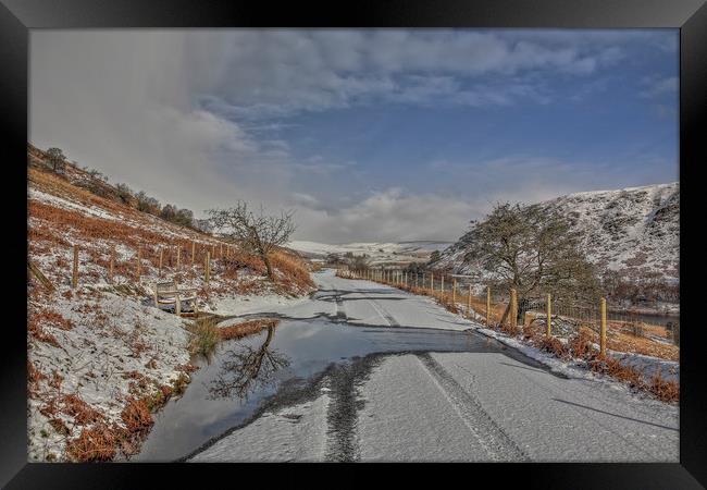 Road through the snow, Elan Valley Framed Print by Sorcha Lewis