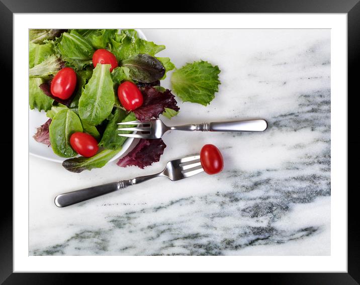Healthy organic salad flowing out of plate  Framed Mounted Print by Thomas Baker