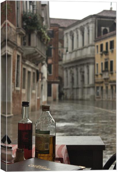 Venice Cafe in the Rain Canvas Print by Lucy Antony