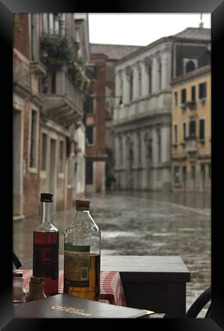 Venice Cafe in the Rain Framed Print by Lucy Antony