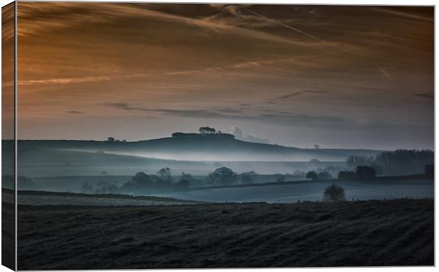 Dawn mist near Minninglow Hill Canvas Print by Nick Lukey