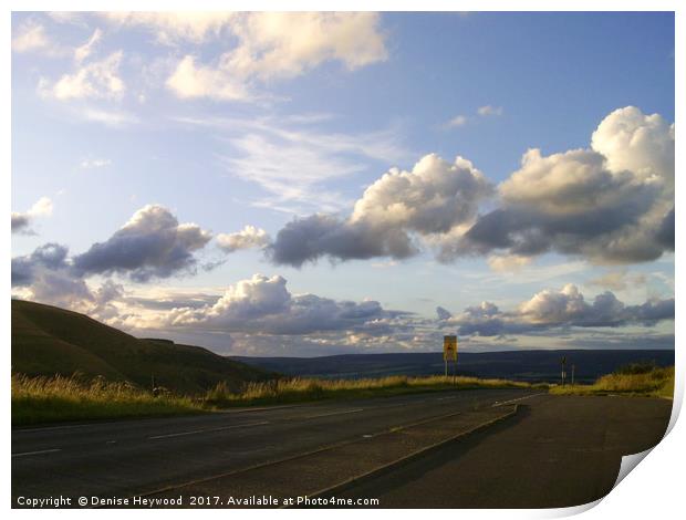 Evening sunlit clouds over Glossop  Print by Denise Heywood