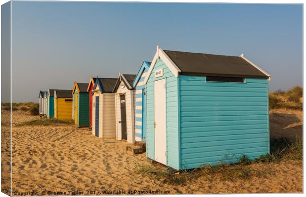 Colourful beach huts on the sand at Southwold  Canvas Print by Graeme Taplin Landscape Photography