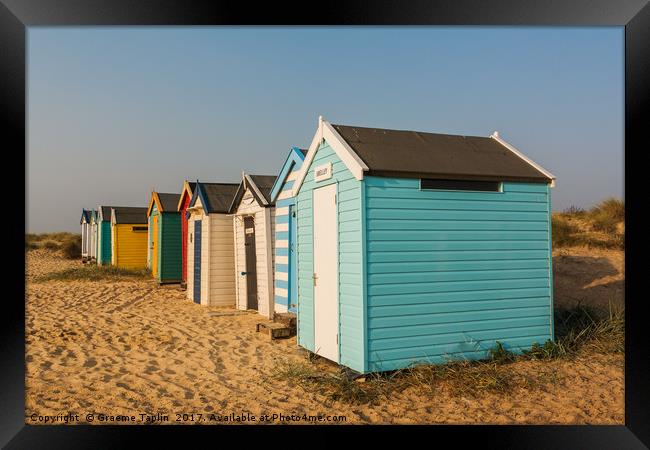 Colourful beach huts on the sand at Southwold  Framed Print by Graeme Taplin Landscape Photography
