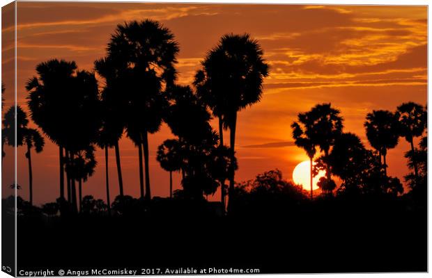 Cambodian sunset Canvas Print by Angus McComiskey