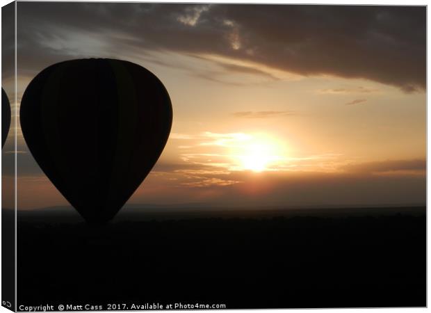 Photo of an Air Balloon with the sun setting over  Canvas Print by Matt Cass