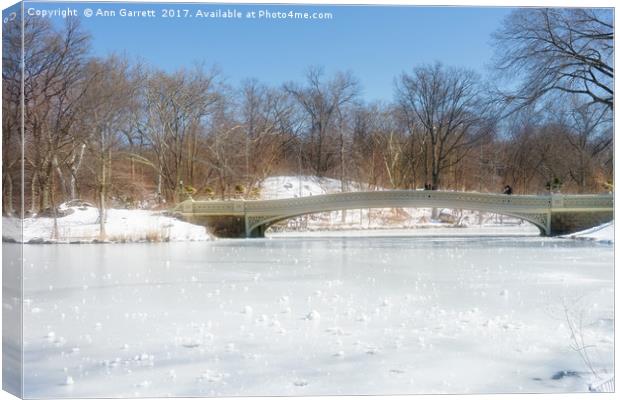 Bow Bridge in Central Park in the Snow Canvas Print by Ann Garrett