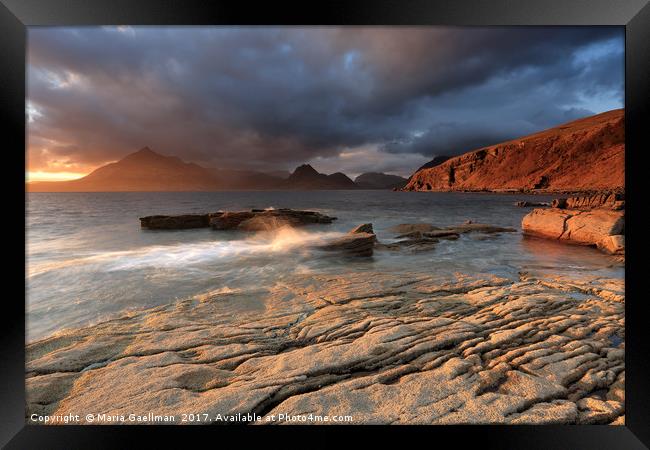 Splashing waves and the Cuillins at Sunset Framed Print by Maria Gaellman