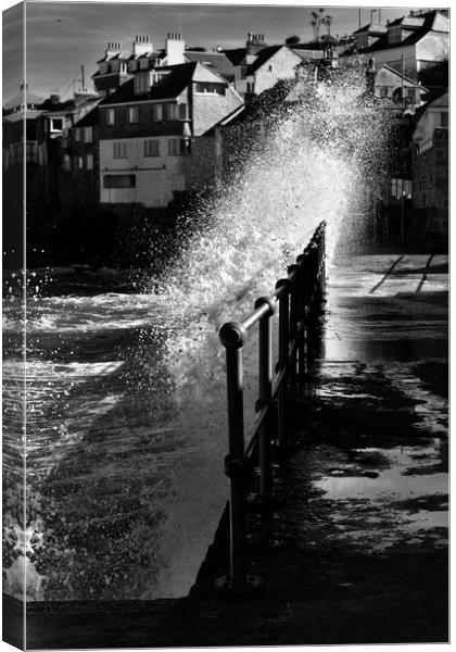 Winter sun and stormy sea Canvas Print by Brian Spooner