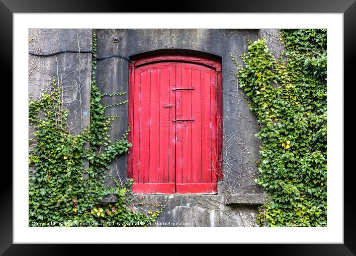 red door on wall Framed Mounted Print by Massimo Lama