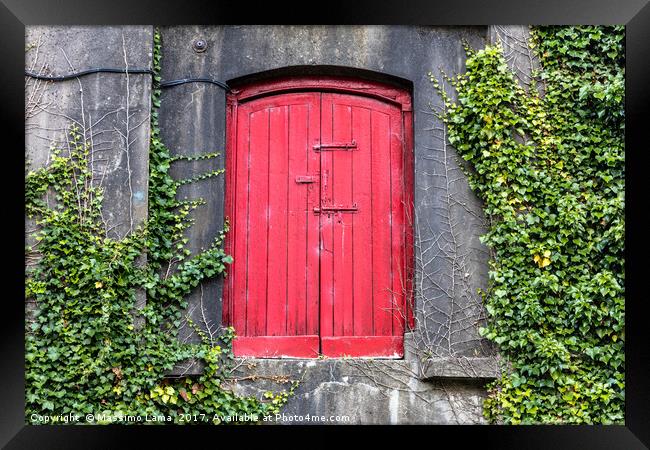 red door on wall Framed Print by Massimo Lama
