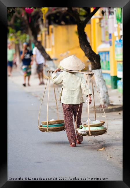 Vietnamese woman carrying products Framed Print by Łukasz Szczepański