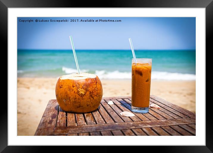 Coconut drink and ice coffee on the wooden table Framed Mounted Print by Łukasz Szczepański