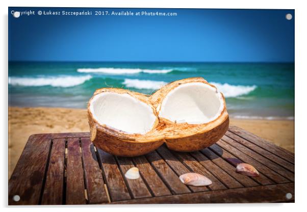 Coconut on the table against beautiful beach Acrylic by Łukasz Szczepański