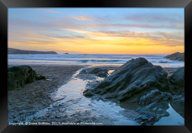 Fistral Beach Sunset by the rocks Framed Print by Diane Griffiths