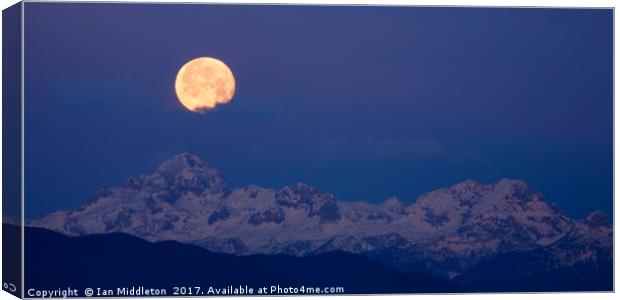 Moonset over the Julian Alps Canvas Print by Ian Middleton
