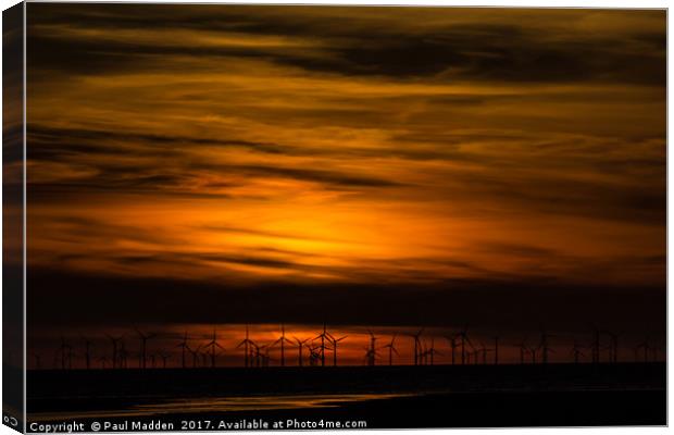 Sunset over the wind farm Canvas Print by Paul Madden